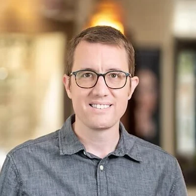 A headshot photo of Ben
